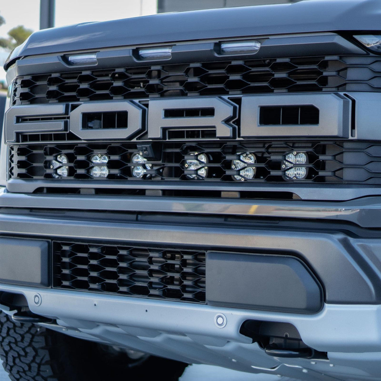 Installed Close View Baja Designs Ford Squadron Pro Behind Grille Light Kit - Ford 2021-22 F-150 Raptor