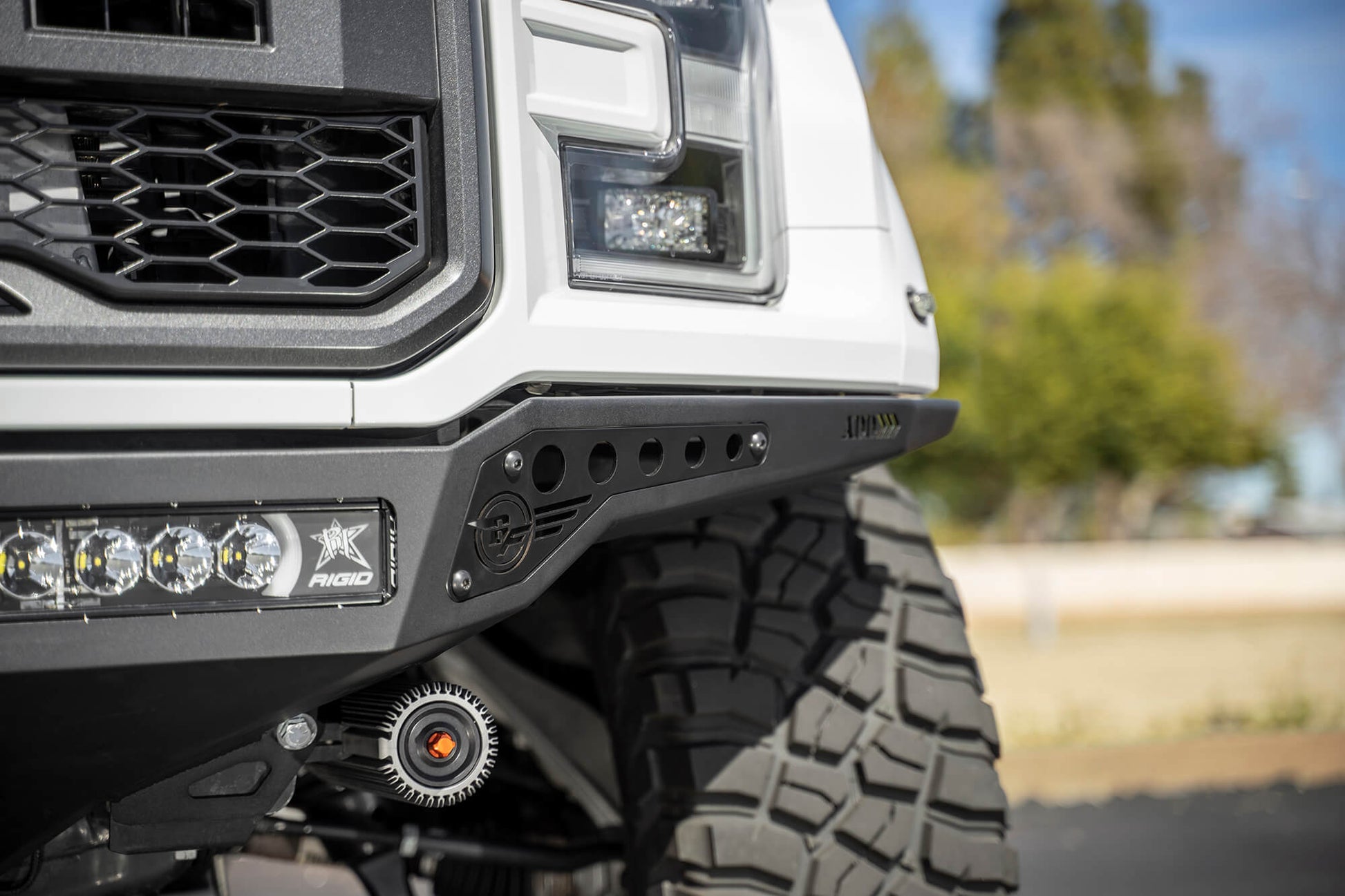 Installed on Car Close Side View of ADD Rock Fighter Frame Cut Front Bumper | 2017-2020 Ford Raptor | Heritage