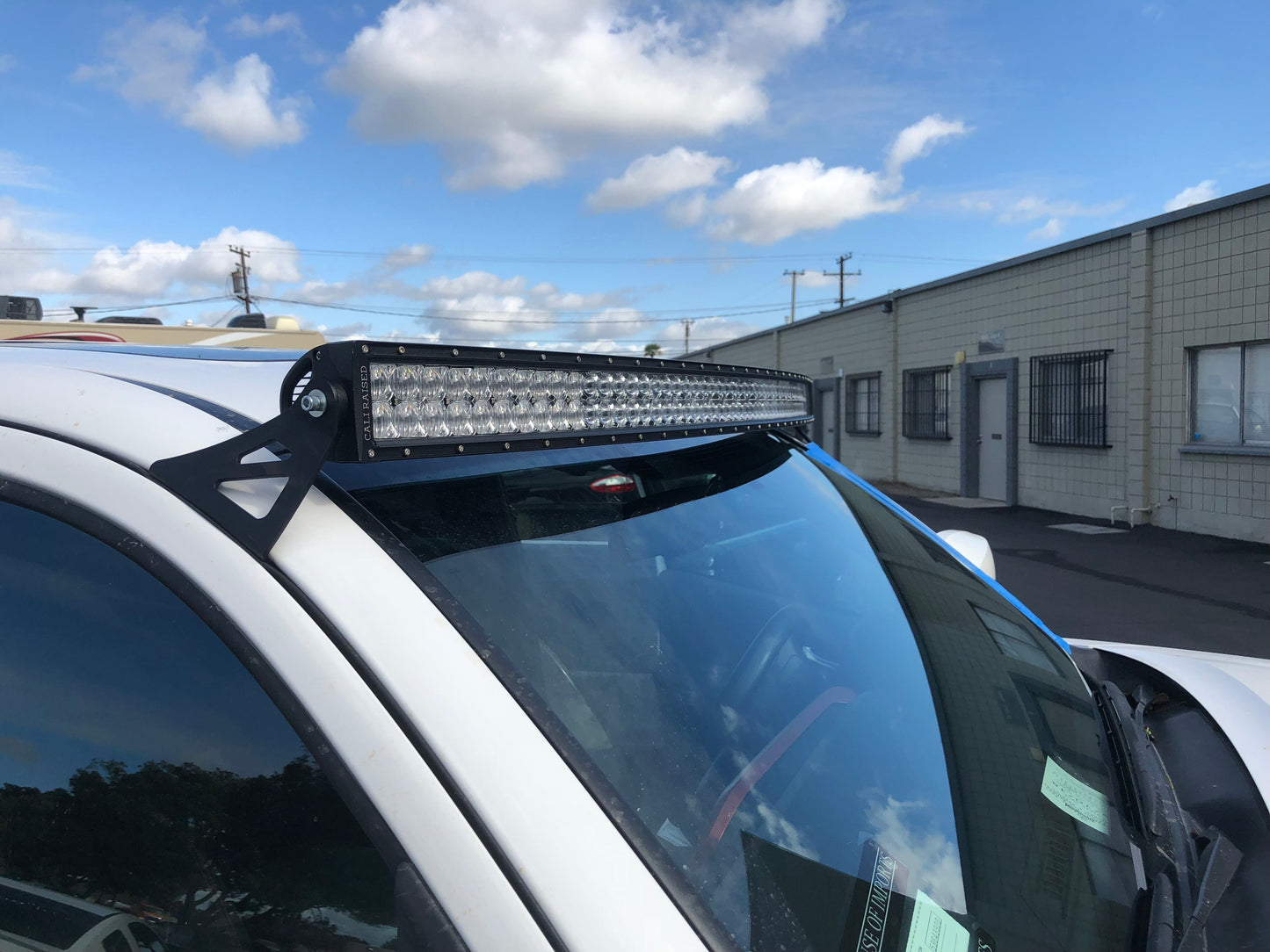 Installed on Car Cali Raised 52" Curved LED Light Bar Roof Brackets Kit | 2005-2023 Toyota Tacoma